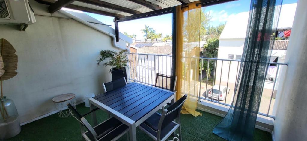 Bright terrace at Le Dodo du Lagon near the beach
